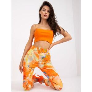 Fashionhunters Oranžové vzorované dámské kalhoty.Velikost: 2XL, XXL